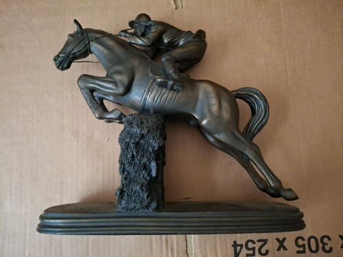 Horse and jockey jumping over - horse,